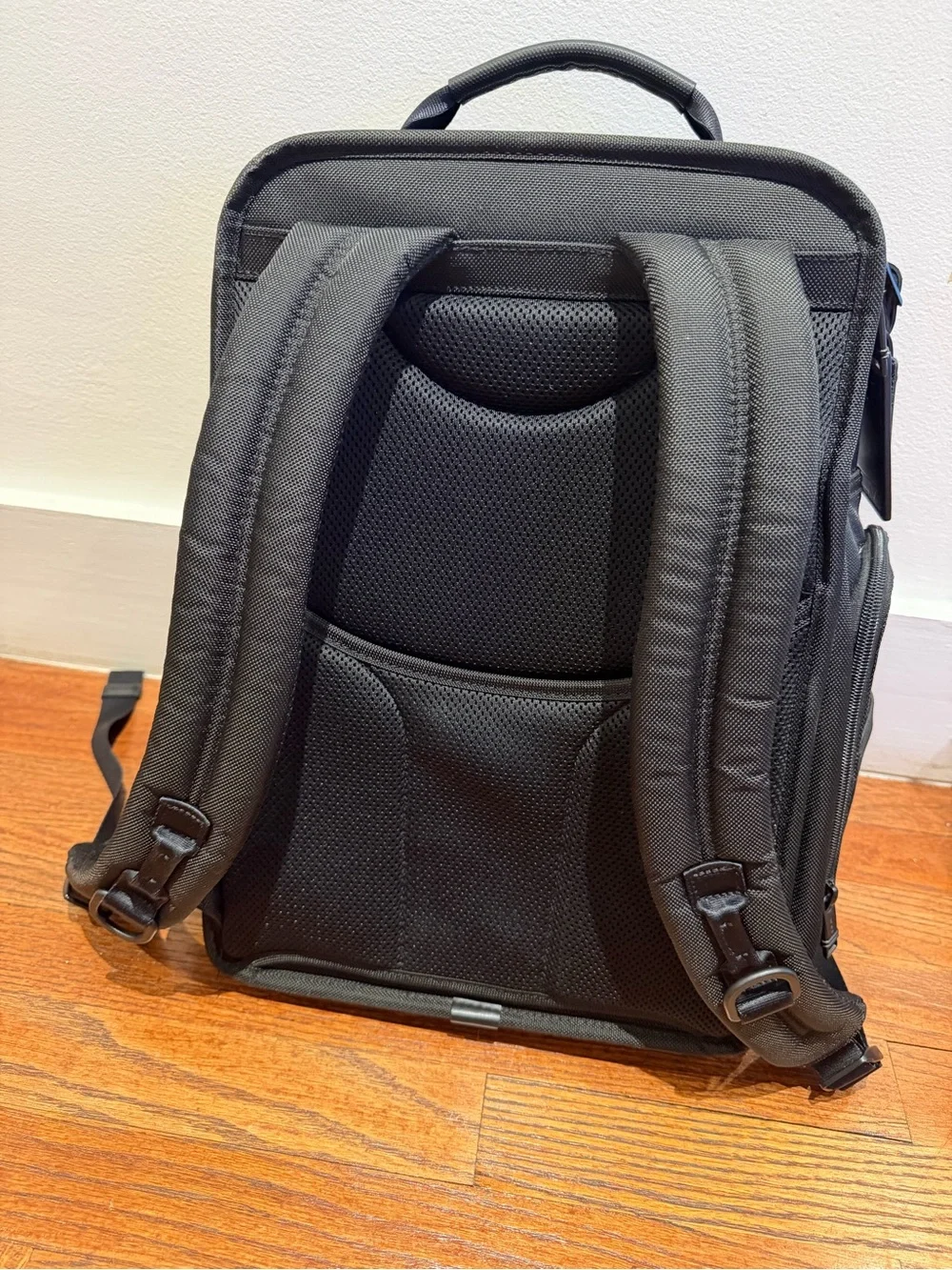 Tumi Black Backpack with Multiple Front Pockets